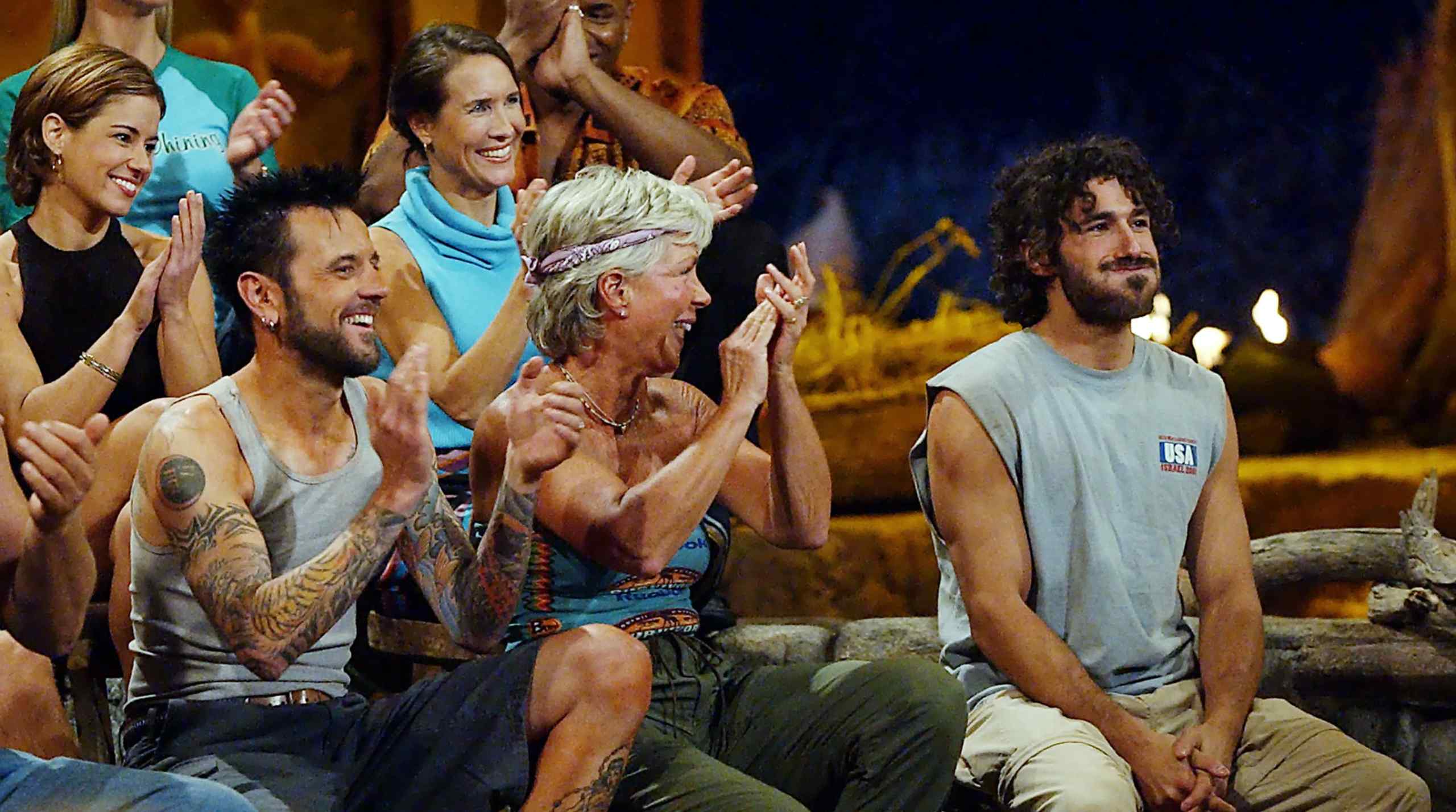 Survivor castmates cheer for Survivor: Africa winner Ethan Zohn.